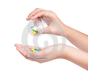 Hand holding Drug capsule on white