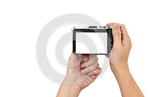 Hand holding DSLR digital camera.