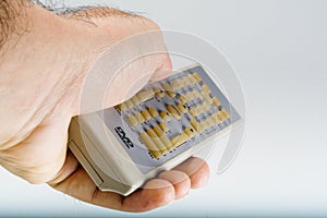 Hand holding a DVD remote