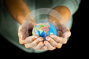 Hand holding earth globe