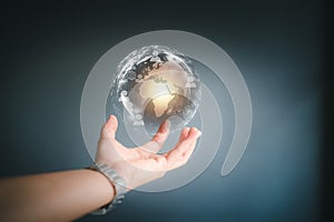 Hand holding a Earth globle in technology concept