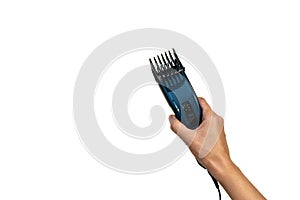 Hand holding electric hair trimmer isolated on white background. Copy space