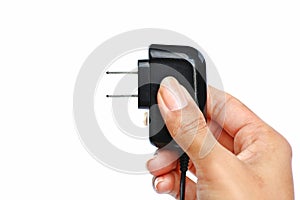 Hand holding Electric plug on white background