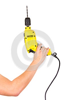 Hand holding electric yellow drill tool