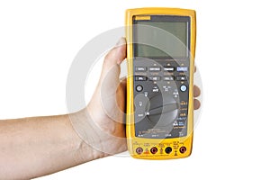 Hand holding electronic multimeter