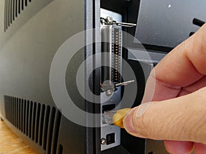 Hand holding Ethernet  connecior to connecting a printer to the net