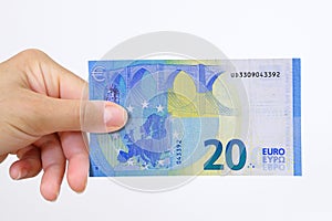 Hand holding a euro bank note on a white background