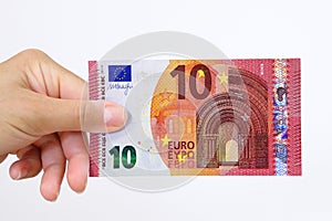 Hand holding a euro bank note on a white background