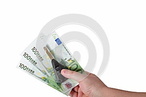 Hand holding euro bills and car keys isolated