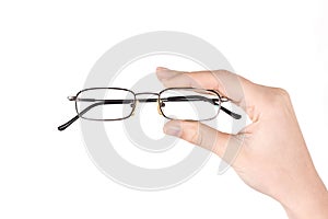 Hand holding eyeglasses
