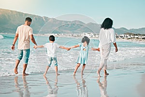Hand holding, family is walking on beach and back view with ocean waves, summer and bonding in nature. Parents, children