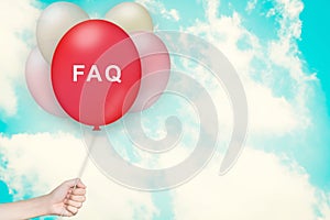 Hand Holding FAQ or Frequently asked questions Balloon