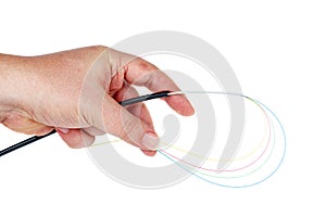 Hand holding fiber optic cable isolated on a white