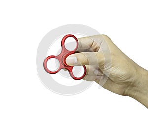 Hand holding fidget spinner isolated on white background. Stress relieving toy