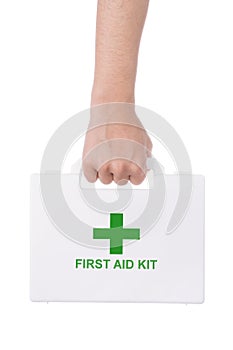 Hand holding a first aid kit