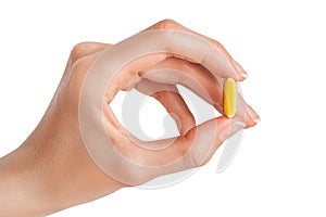 Hand holding Fish oil softgel capsules  on white background. Omega 3 dietary supplement