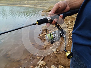 hand holding a fishing tool