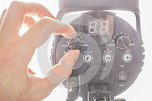 Hand holding a flash light isolated on white background