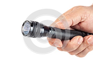 Hand holding flashlight on white background