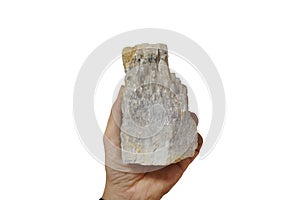 A hand holding fluorite mineral rock, isolated on white background.