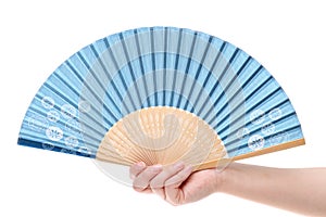 Hand holding folding fan