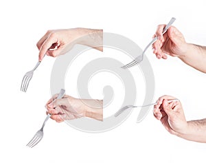 Hand holding fork, on white