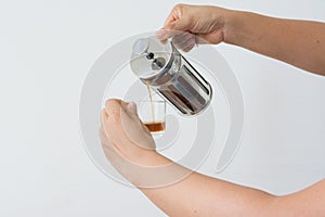 Hand holding a French Press coffee
