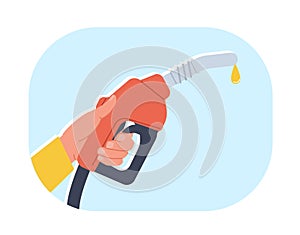 Hand holding gasoline fuel pump with yellow drop of oil. Automobile benzine and biodiesel. Gas station. Nozzle and hose