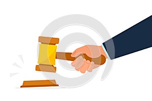 Hand holding gavel or auction hammer