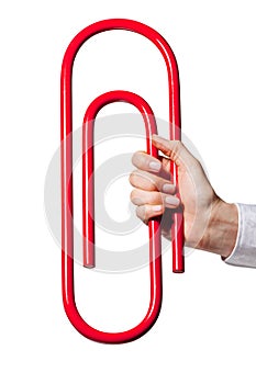 Hand holding giant paper-clip