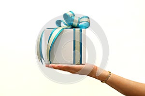 hand holding gift box on white