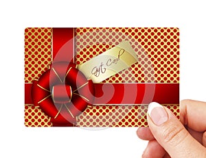 Hand holding gift card isolated over white