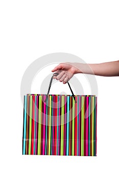 The hand holding giftbag on white