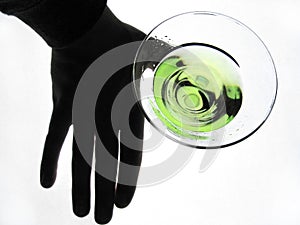Hand holding glass of Martini