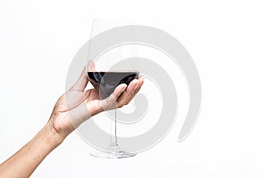 Hand holding a glass of wine