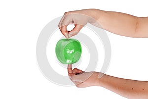 Hand holding green apple