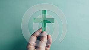 The hand holding paper cross.AI generated image