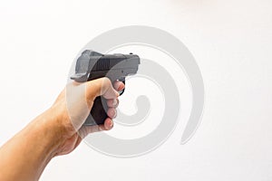 Hand holding a gun photo