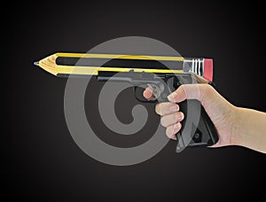 Hand holding gun with pencil point