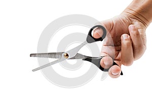 Hand holding hair scissors on white