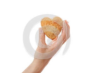 Hand holding heartshape cake