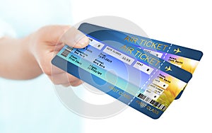 Hand holding holiday airline boarding pass tickets