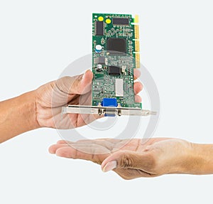 Hand holding IC chip.