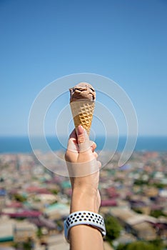 Hand holding an ice cream cone