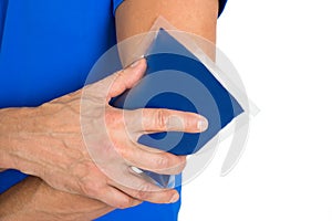 Hand holding ice gel pack on elbow