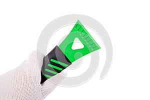 Hand holding an ice scraper