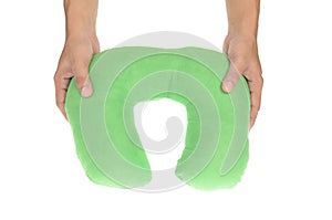Hand holding inflatable travel cervical pillow