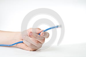 Hand holding internet cable.