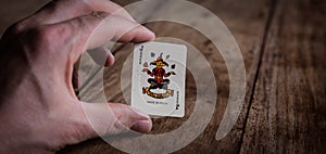 Hand holding Joker Wild Card | Playing Cards | Gambling | Gambler | Poker Game