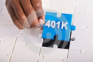 Hand Holding 401k Jigsaw Puzzle photo